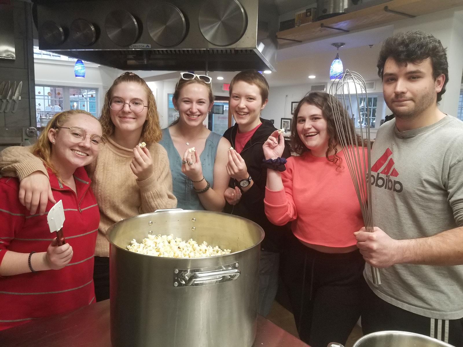 The Compost Team prepares a batch of popcorn with healthy fats for an educational movie night at the Food Lab.